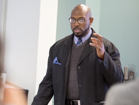 African American male instructor teaching in classroom